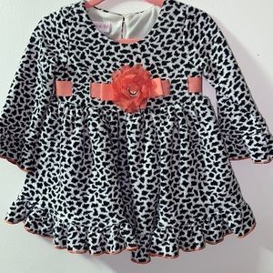 Fancy printed Bonnie Baby top. Peach flower band.